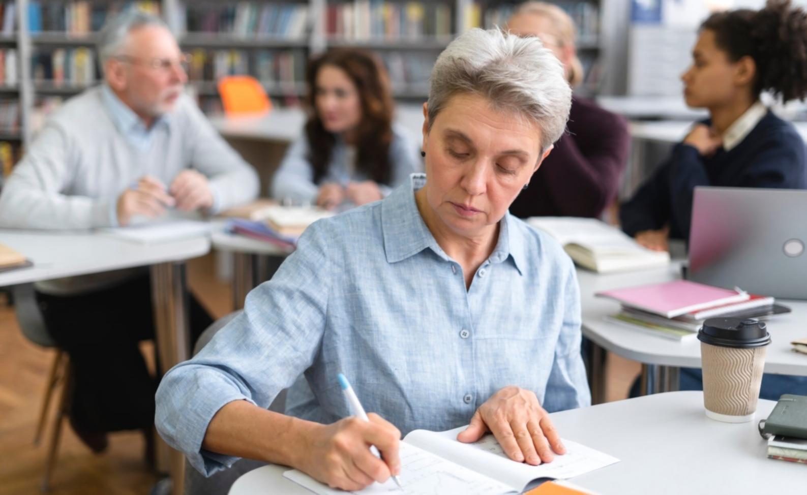 Person reviewing financial documents and planning budget